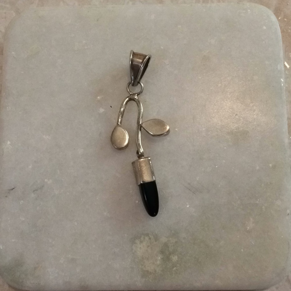 Silver and onyx pendant. No chain